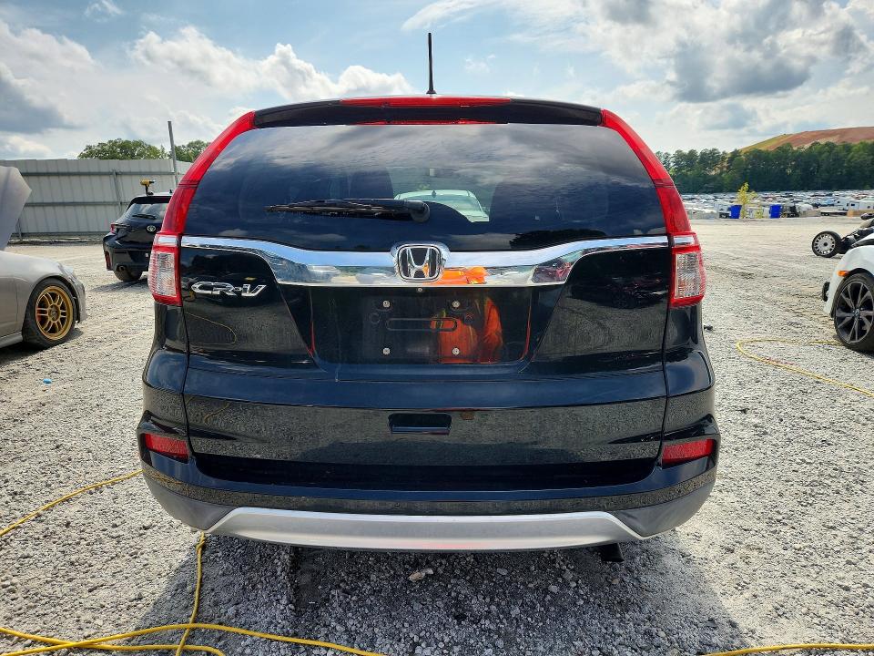Photo 6 from auction – 2015 HONDA CR-V with VIN 2HKRM3H58FH514137