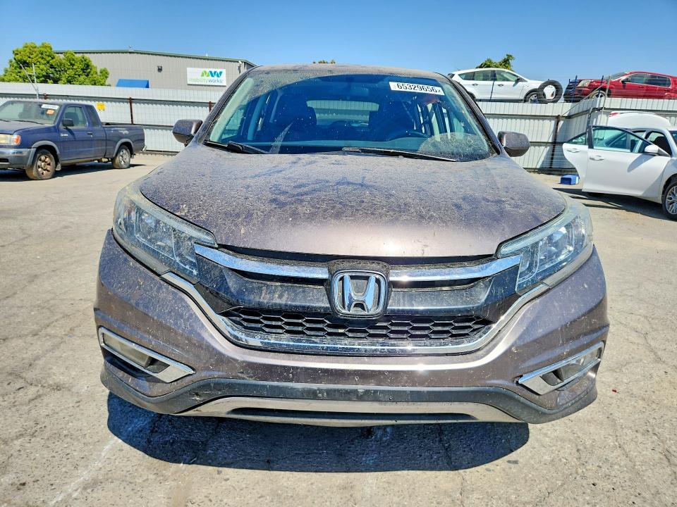 Photo 5 from auction – 2015 HONDA CR-V with VIN 3CZRM3H50FG707501