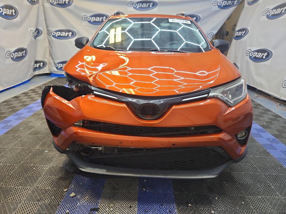 Photo 5 from auction – 2016 TOYOTA RAV4 with VIN JTMBFREV6GJ098391