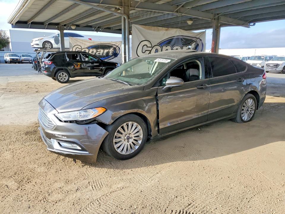FORD FUSION 2018 with VIN 3FA6P0LU1JR128517 - Photo from auction