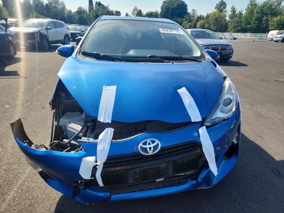 Photo 5 from auction – 2015 TOYOTA PRIUS C with VIN JTDKDTB35F1583092