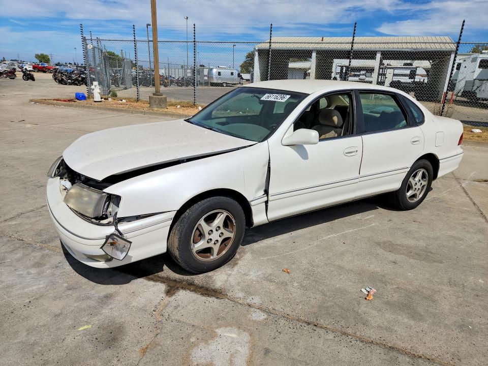 TOYOTA AVALON 1999 with VIN 4T1BF18B2XU299928 - Photo from auction