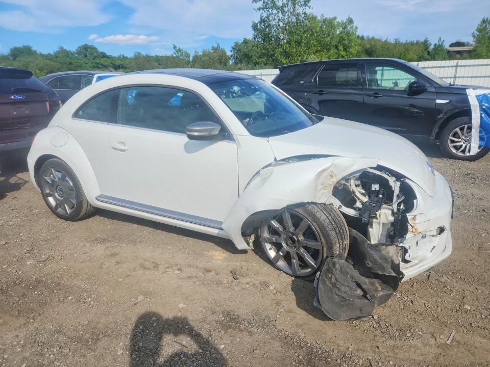 Photo 4 from auction – 2014 VOLKSWAGEN BEETLE with VIN 3VWJL7AT8EM653397