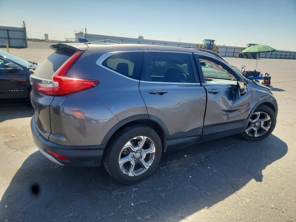 Photo 3 from auction – 2018 HONDA CR-V with VIN 7FARW1H55JE017069