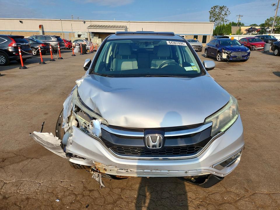 Photo 5 from auction – 2015 HONDA CR-V with VIN 2HKRM4H52FH660913