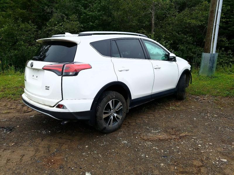 Photo 3 from auction – 2018 TOYOTA RAV4 with VIN 2T3RFREV5JW734872