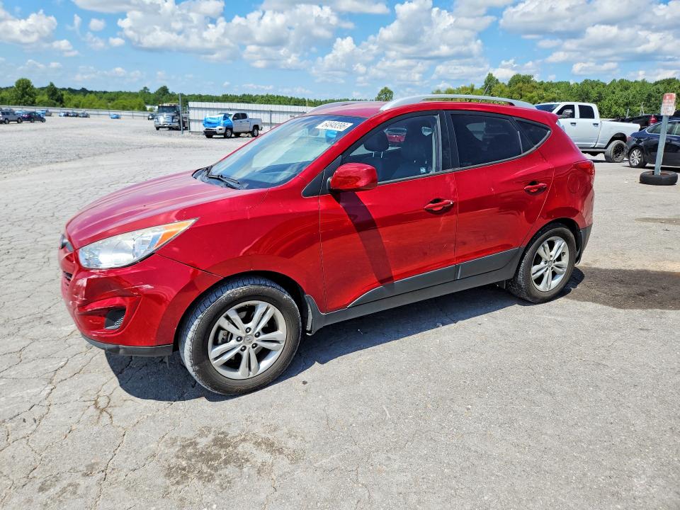HYUNDAI TUCSON 2011 with VIN KM8JUCAC0BU227487 - Photo from auction