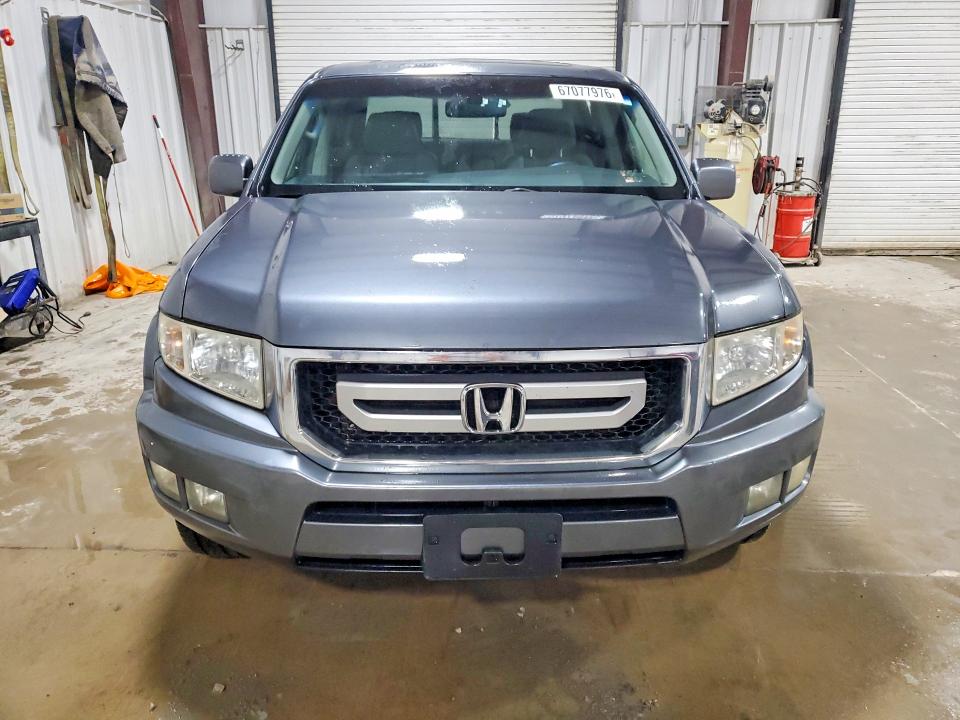 Photo 5 from auction – 2011 HONDA RIDGELINE with VIN 5FPYK1F55BB006538