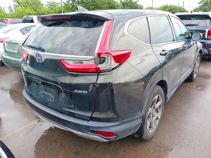 Photo 4 from auction – 2018 HONDA CR-V with VIN 7FARW2H82JE010998