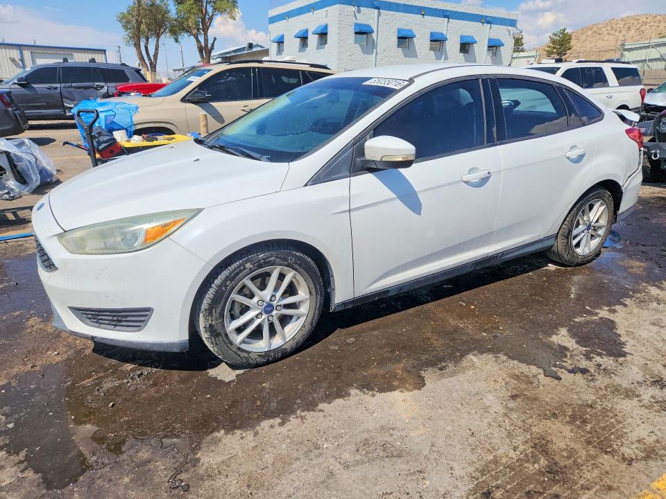 FORD FOCUS 2016 with VIN 1FADP3F20GL352890 - Photo from auction