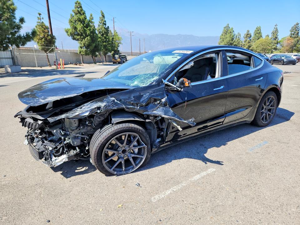 TESLA MODEL 3 2018 with VIN 5YJ3E1EA2JF010098 - Photo from auction