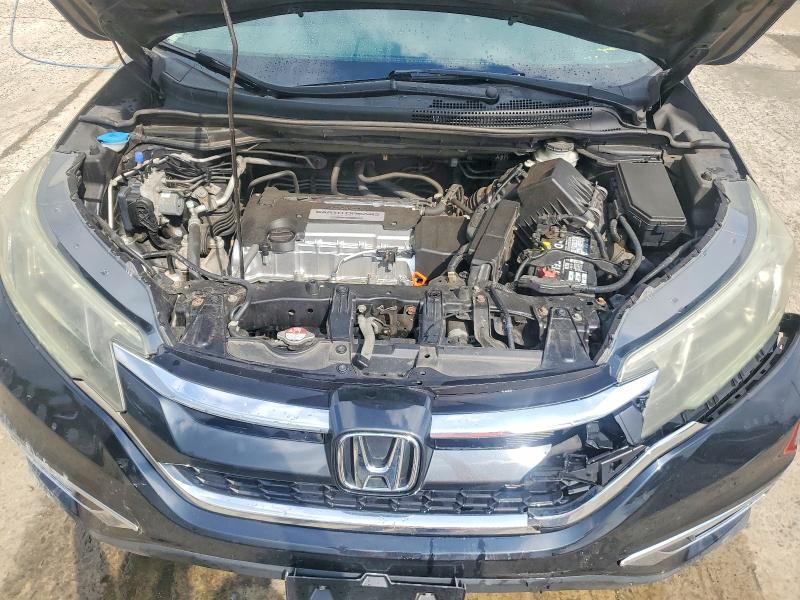 Photo 11 from auction – 2015 HONDA CR-V with VIN 2HKRM4H73FH698135