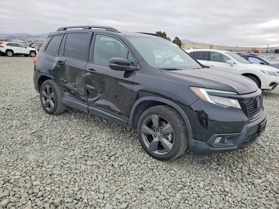 Photo 4 from auction – 2021 HONDA PASSPORT with VIN 5FNYF7H99MB010546