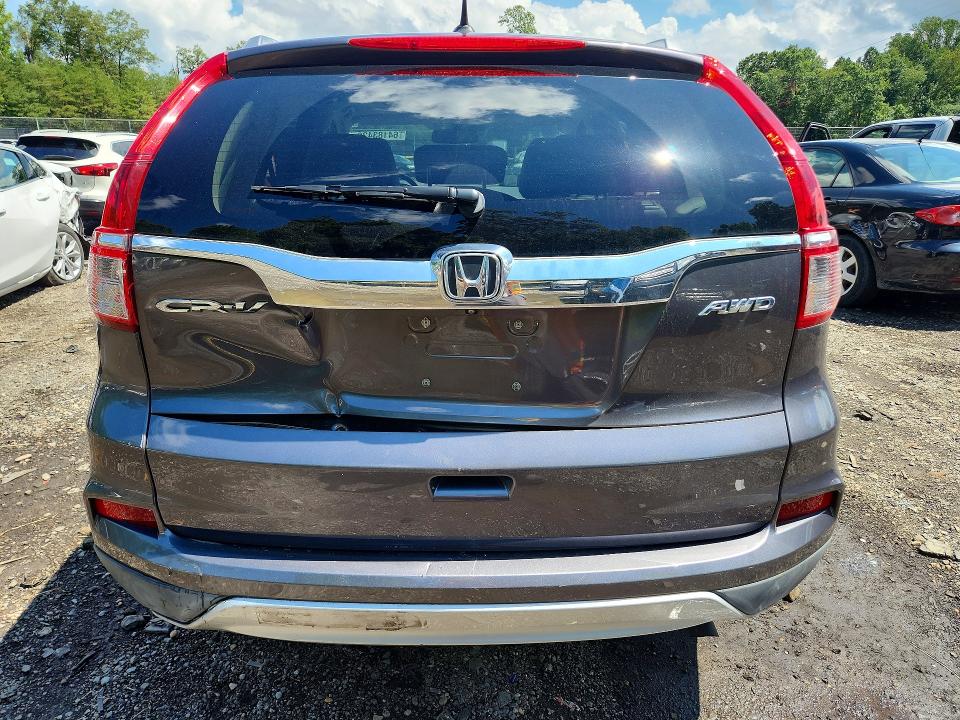 Photo 6 from auction – 2015 HONDA CR-V with VIN 2HKRM4H77FH608307