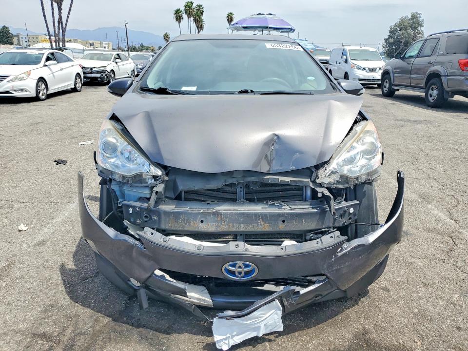 Photo 5 from auction – 2014 TOYOTA PRIUS C with VIN JTDKDTB34E1570042