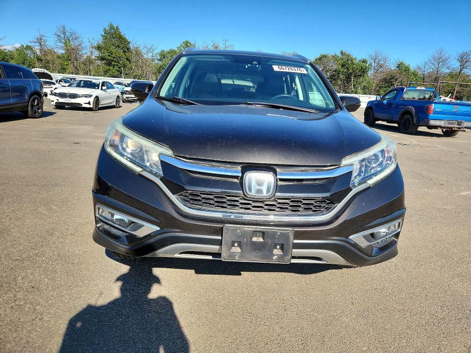 Photo 5 from auction – 2015 HONDA CR-V with VIN 5J6RM4H94FL032764