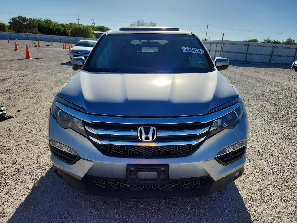 Photo 5 from auction – 2016 HONDA PILOT with VIN 5FNYF5H5XGB004311