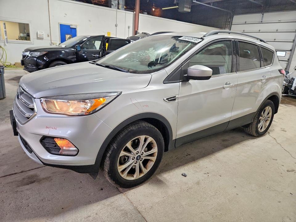 FORD ESCAPE 2018 with VIN 1FMCU9GD2JUC39599 - Photo from auction