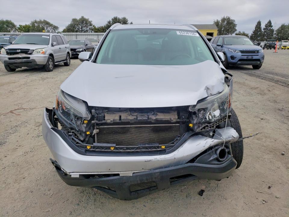 Photo 5 from auction – 2014 HONDA CR-V with VIN 2HKRM4H71EH608494