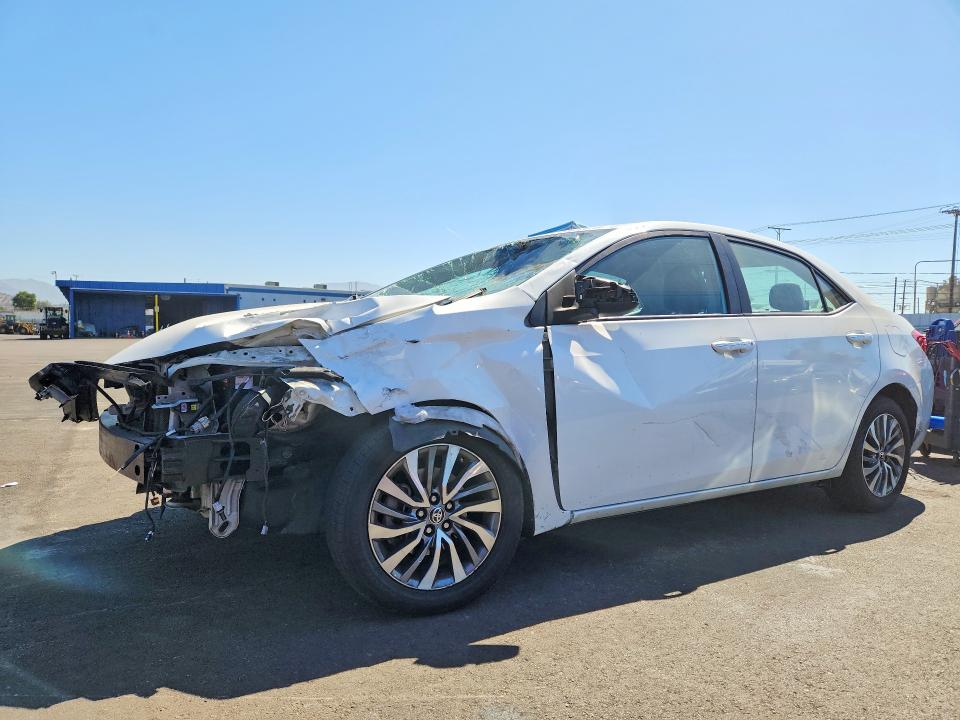 TOYOTA COROLLA 2018 with VIN 5YFBURHE1JP797206 - Photo from auction