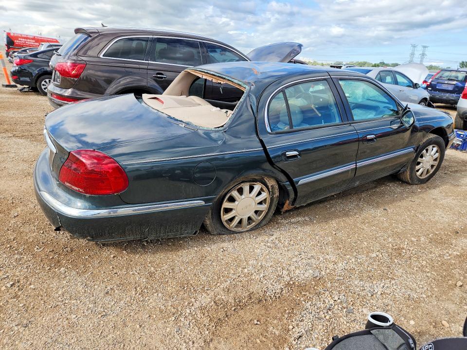 Photo 3 from auction – 2002 LINCOLN CONTINENTAL with VIN 1LNHM97V02Y672590