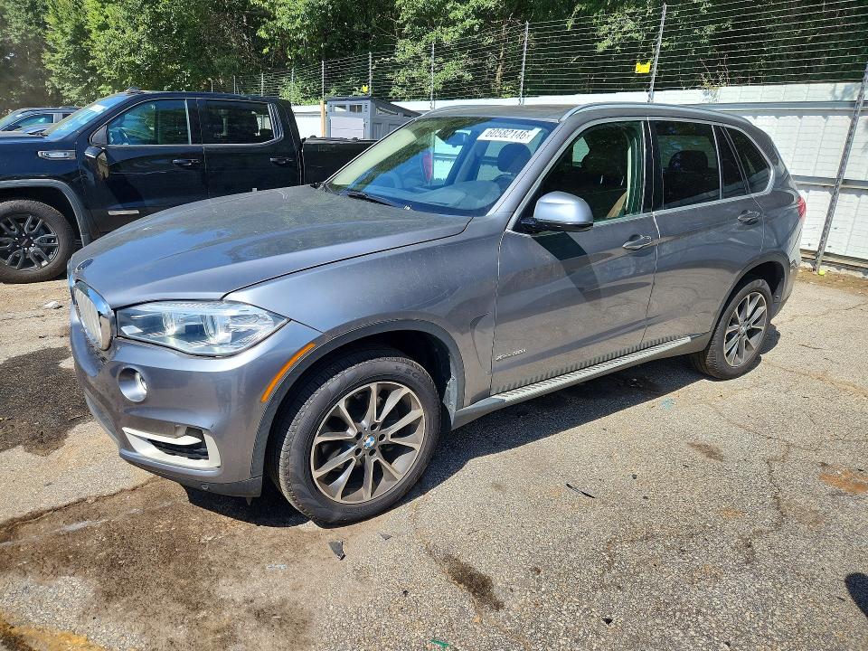 BMW X5 2016 with VIN 5UXKR0C5XG0U10853 - Photo from auction