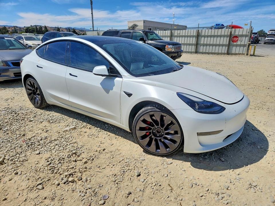 Photo 4 from auction – 2021 TESLA MODEL 3 with VIN 5YJ3E1EC9MF074001