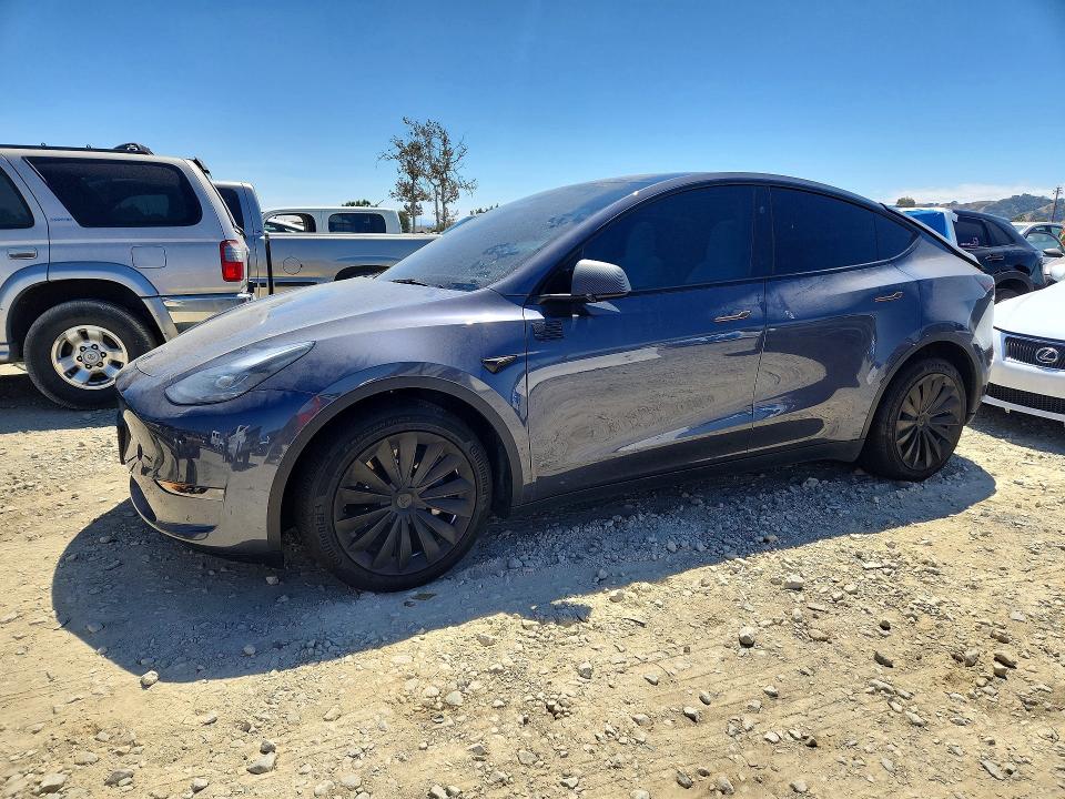 TESLA MODEL Y 2023 with VIN 7SAYGAEE2PF965739 - Photo from auction