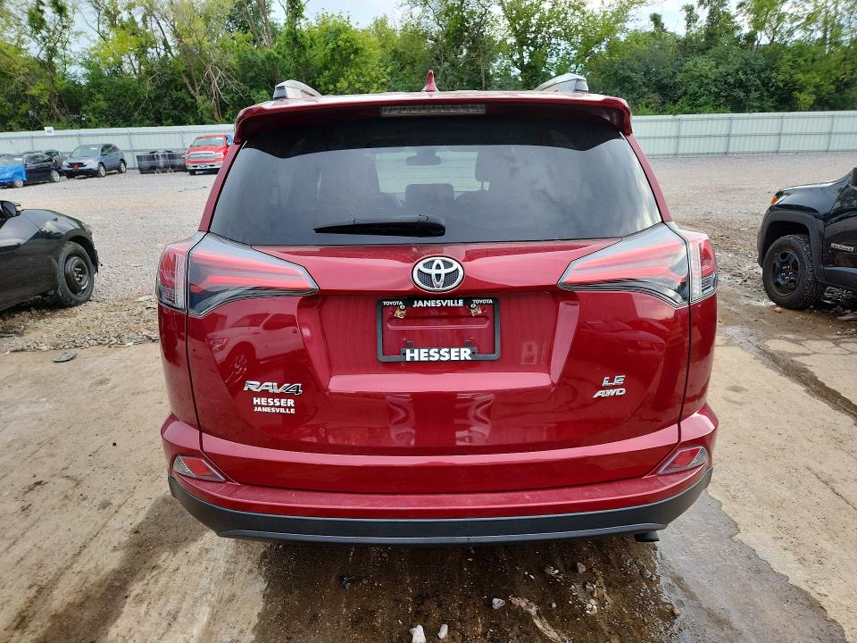 Photo 6 from auction – 2018 TOYOTA RAV4 with VIN 2T3BFREV9JW829646