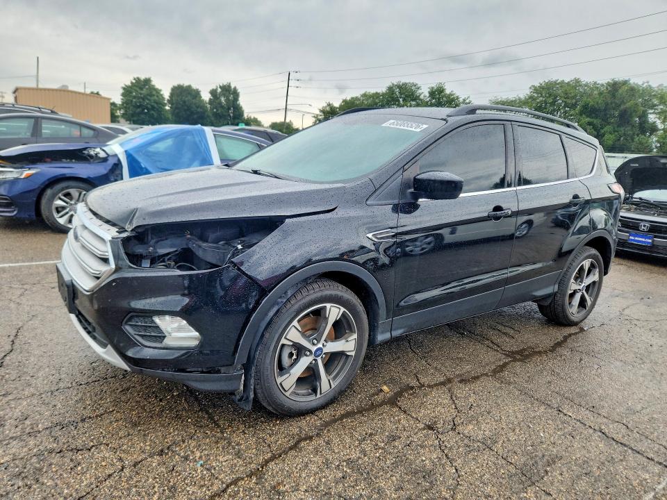FORD ESCAPE 2018 with VIN 1FMCU9HD5JUB51080 - Photo from auction