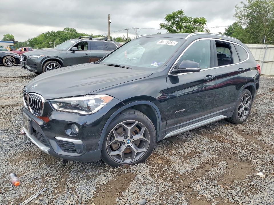 BMW X1 2017 with VIN WBXHT3Z34H4A55974 - Photo from auction