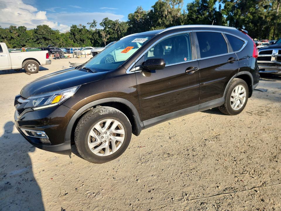 HONDA CR-V 2015 with VIN 2HKRM4H73FH125543 - Photo from auction