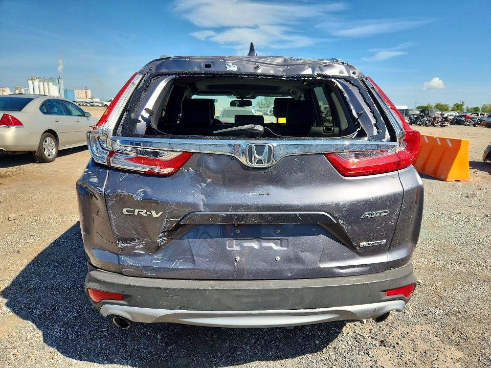 Photo 6 from auction – 2018 HONDA CR-V with VIN 7FARW2H93JE061807
