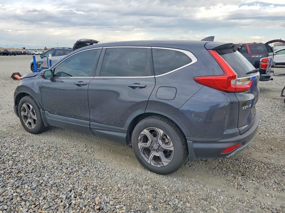 Photo 2 from auction – 2018 HONDA CR-V with VIN 7FARW1H52JE026358