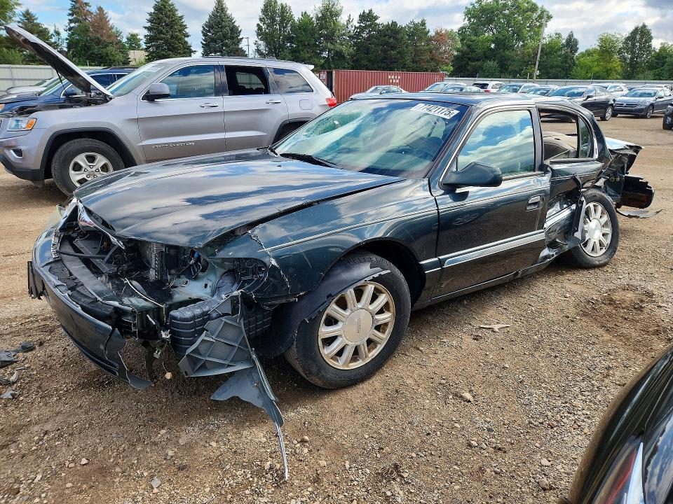 Photo 1 from auction – 2002 LINCOLN CONTINENTAL with VIN 1LNHM97V02Y672590