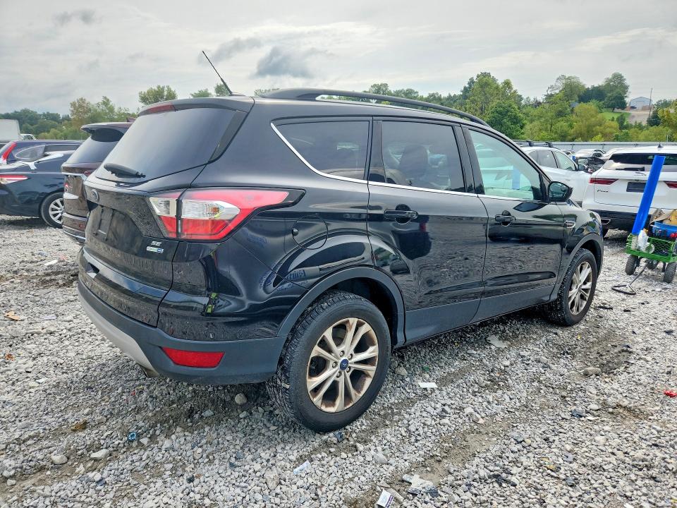 Photo 3 from auction – 2018 FORD ESCAPE with VIN 1FMCU9GD1JUC61531