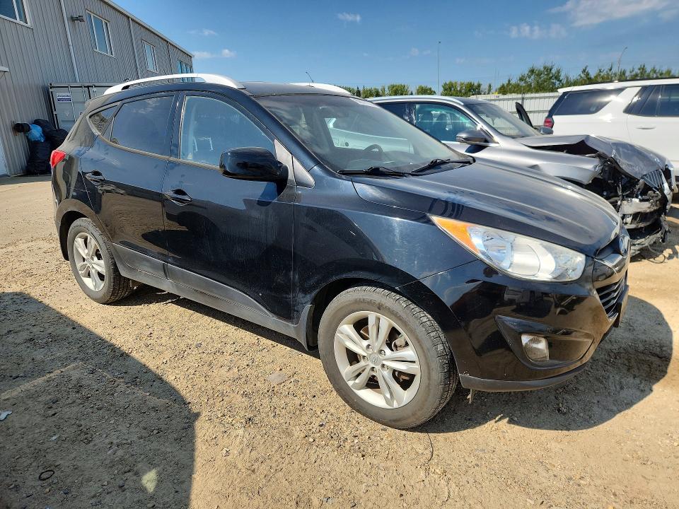 Photo 4 from auction – 2011 HYUNDAI TUCSON with VIN KM8JUCAC0BU178713