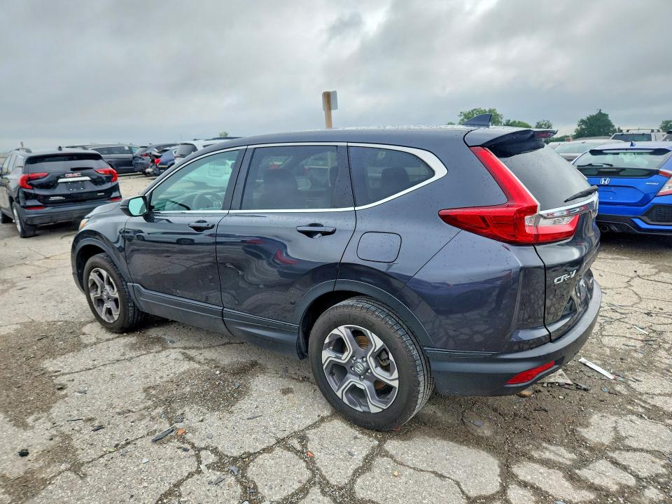 Photo 2 from auction – 2018 HONDA CR-V with VIN 7FARW2H51JE013297