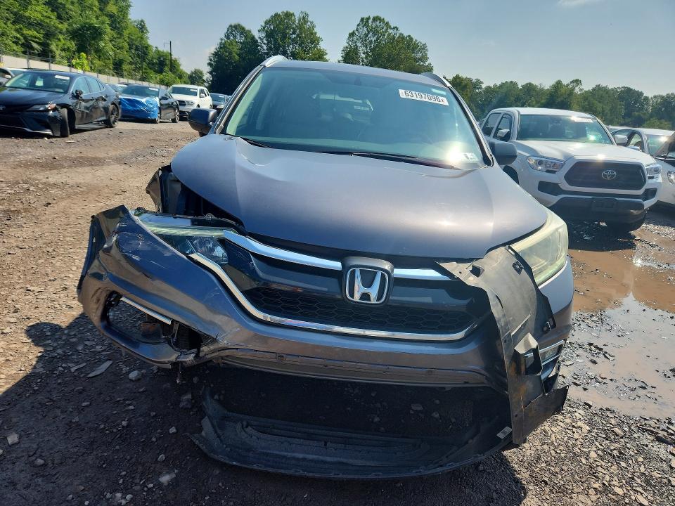 Photo 5 from auction – 2015 HONDA CR-V with VIN 2HKRM4H78FH615962