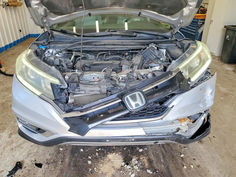 Photo 12 from auction – 2015 HONDA CR-V with VIN 5J6RM4H95FL132811