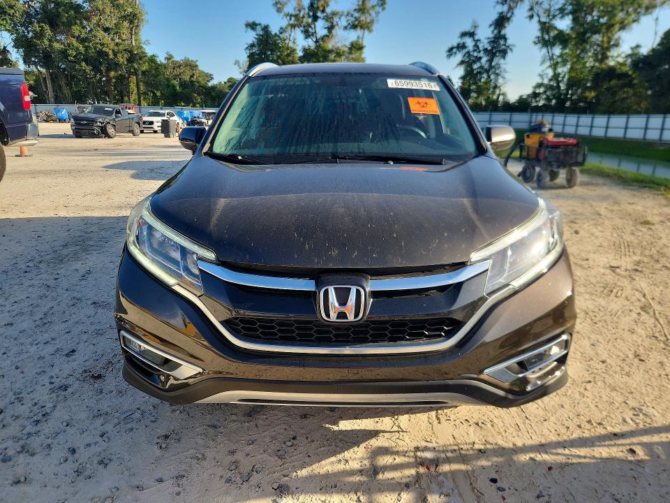 Photo 5 from auction – 2015 HONDA CR-V with VIN 2HKRM4H73FH125543