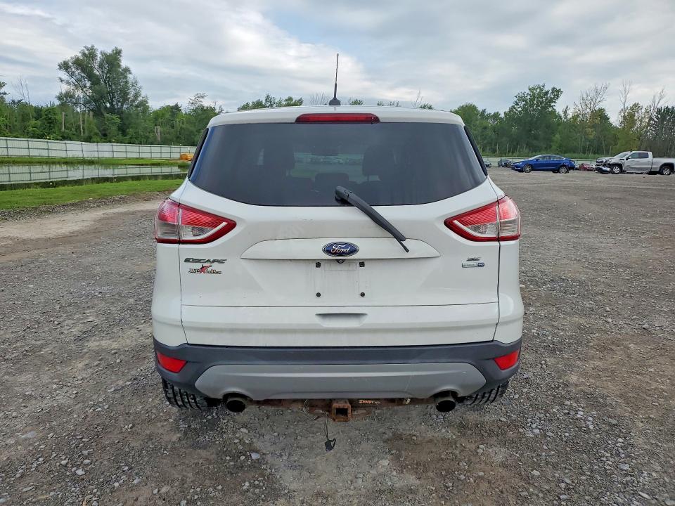 Photo 6 from auction – 2015 FORD ESCAPE with VIN 1FMCU9G95FUA11454
