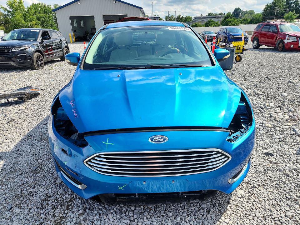 Photo 5 from auction – 2015 FORD FOCUS with VIN 1FADP3N20FL386604