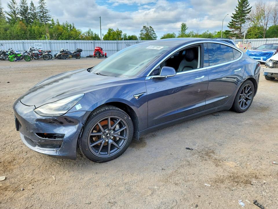 TESLA MODEL 3 2020 with VIN 5YJ3E1EAXLF720711 - Photo from auction