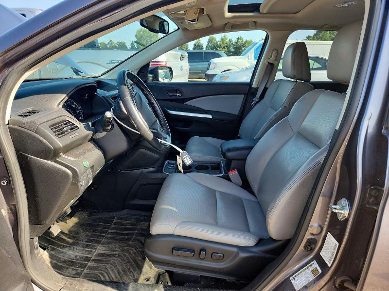 Photo 7 from auction – 2015 HONDA CR-V with VIN 2HKRM4H71FH668079