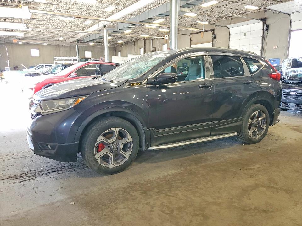 HONDA CR-V 2018 with VIN 7FARW2H55JE080582 - Photo from auction