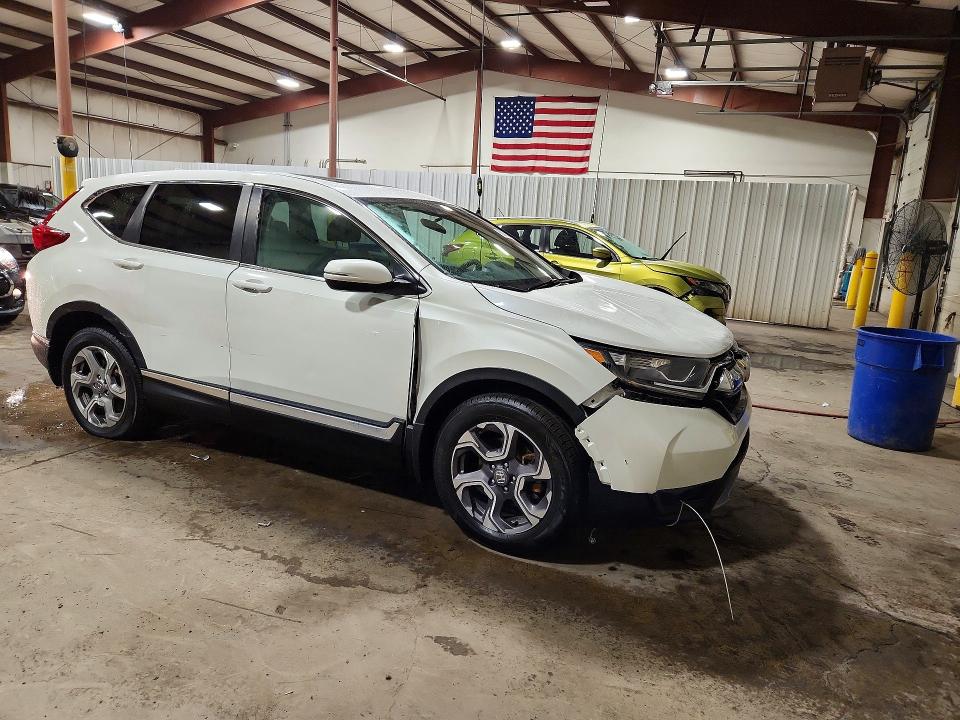 Photo 4 from auction – 2017 HONDA CR-V with VIN 5J6RW2H5XHL041824