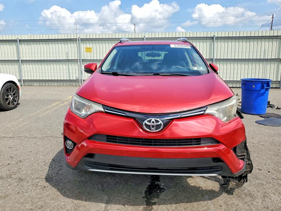 Photo 5 from auction – 2016 TOYOTA RAV4 with VIN JTMRFREV0GJ054465