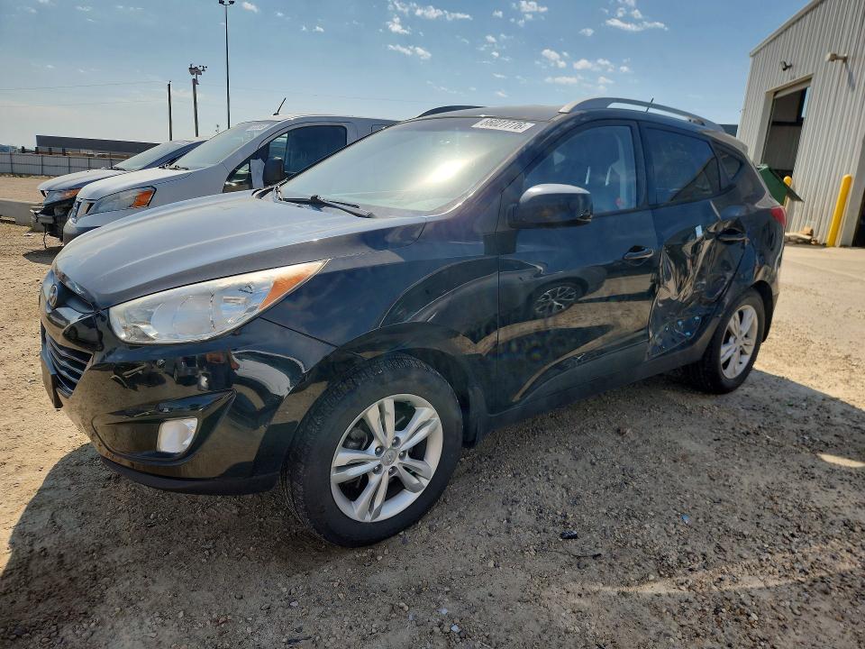 HYUNDAI TUCSON 2011 with VIN KM8JUCAC0BU178713 - Photo from auction