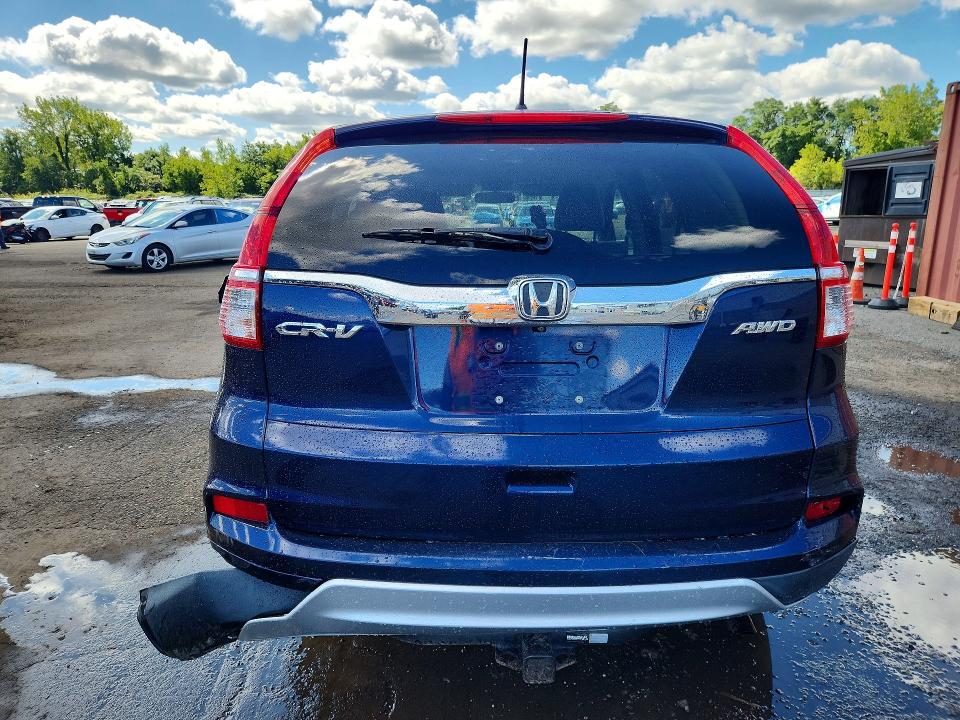 Photo 6 from auction – 2015 HONDA CR-V with VIN 2HKRM4H53FH664937